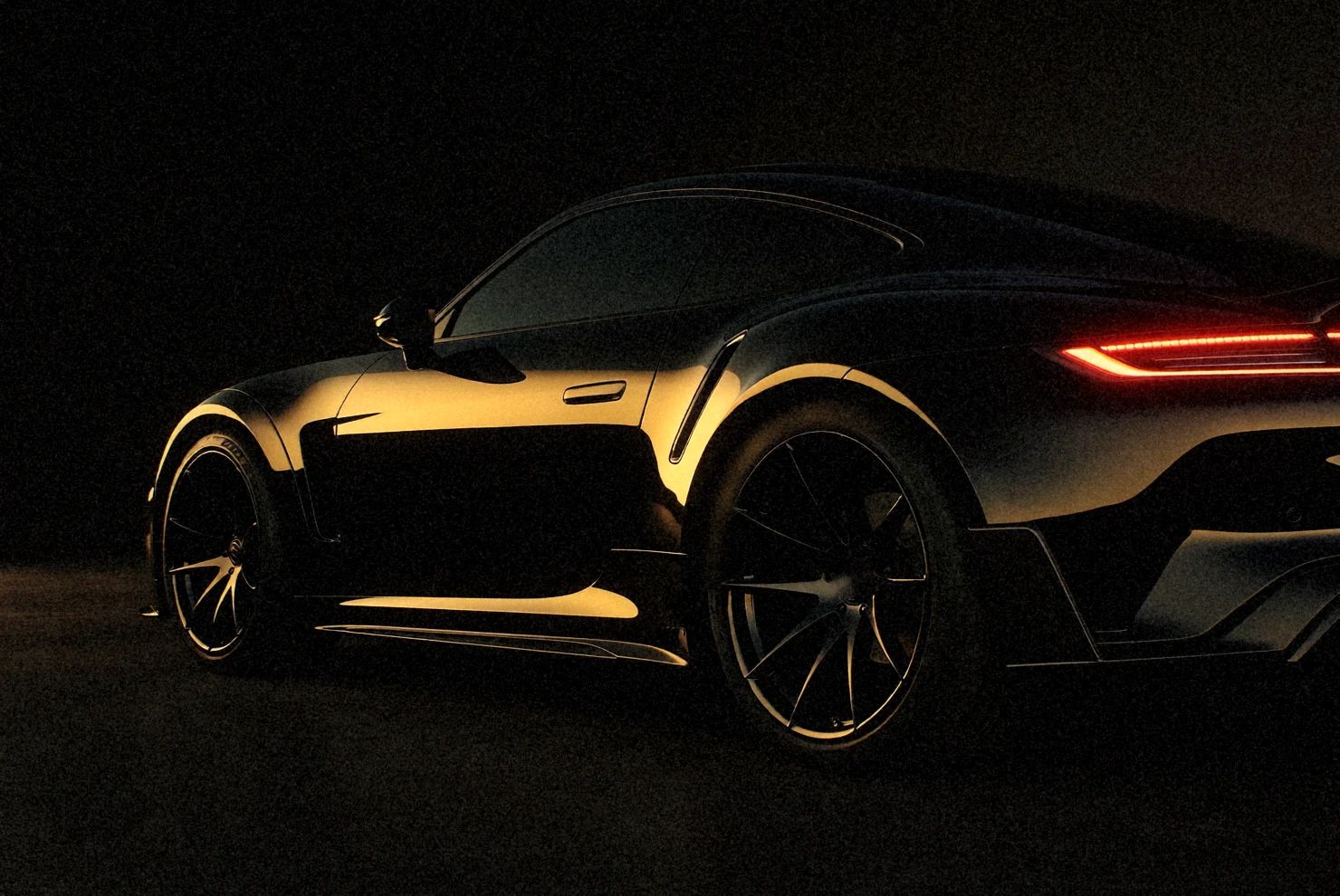 Black sports car after paint correction, clear mirror reflections
